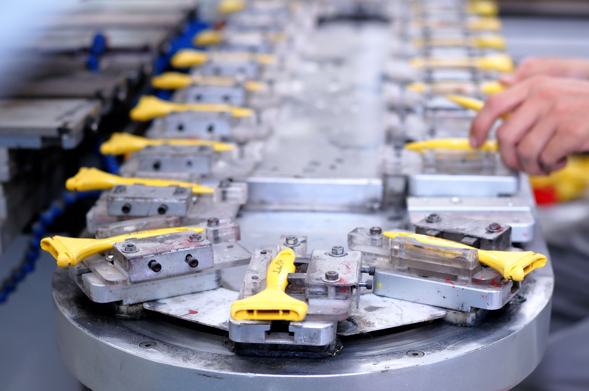 Operator loading parts on an automated assembly line